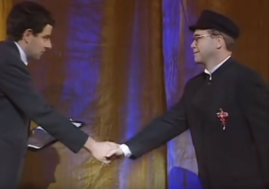 Detail Elton John Rowan Atkinson Nomer 14