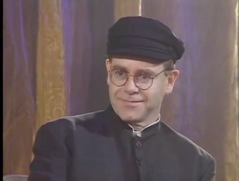 Detail Elton John Rowan Atkinson Nomer 17