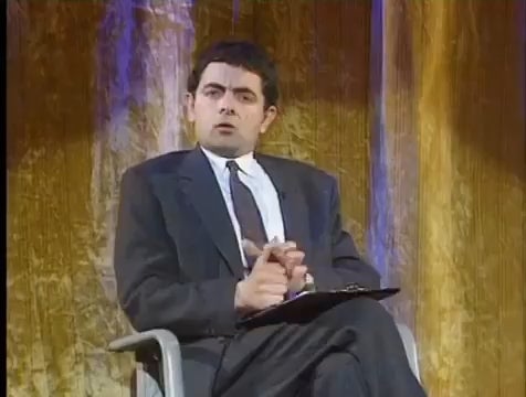 Detail Elton John Rowan Atkinson Nomer 18