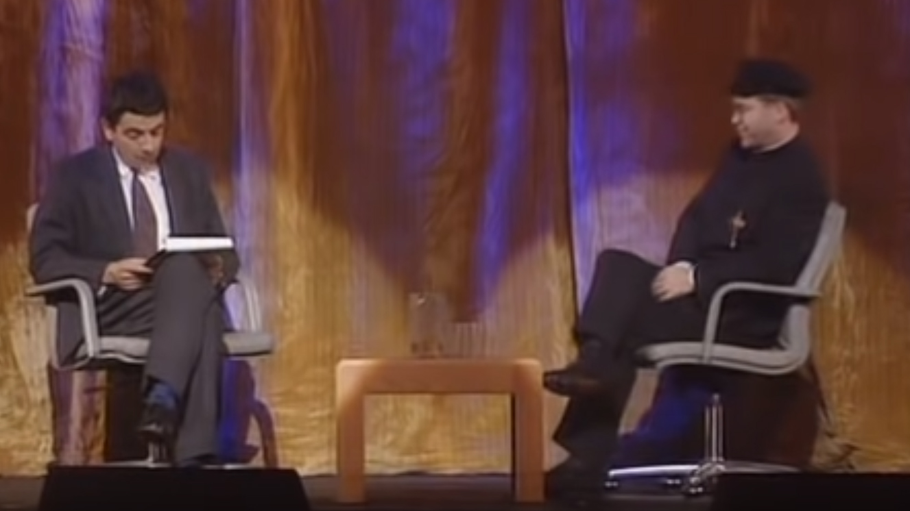 Detail Elton John Rowan Atkinson Nomer 29
