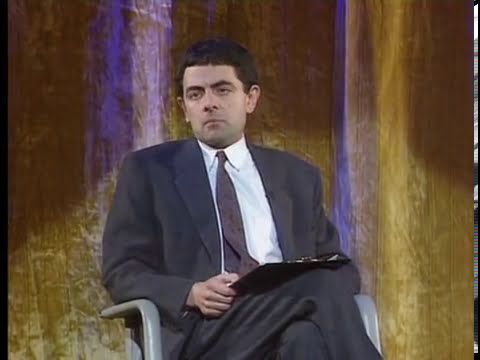 Detail Elton John Rowan Atkinson Nomer 36