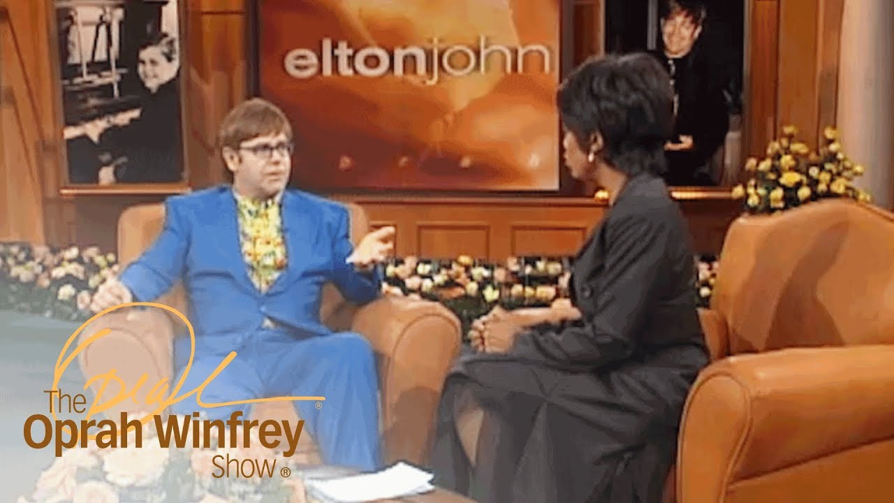 Detail Elton John Rowan Atkinson Nomer 37