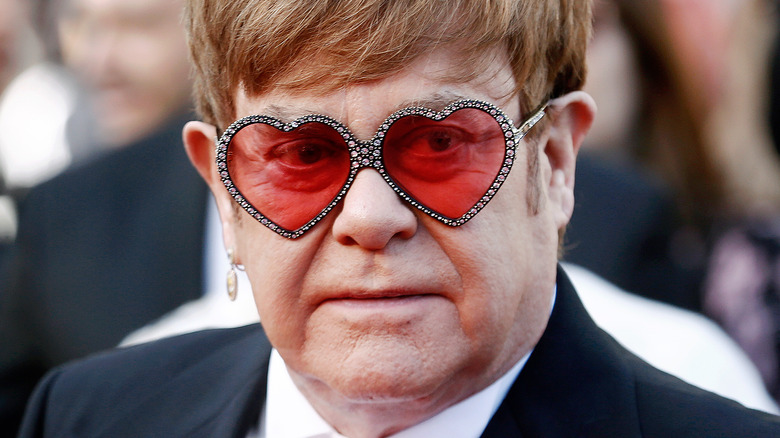 Detail Elton John Rowan Atkinson Nomer 43