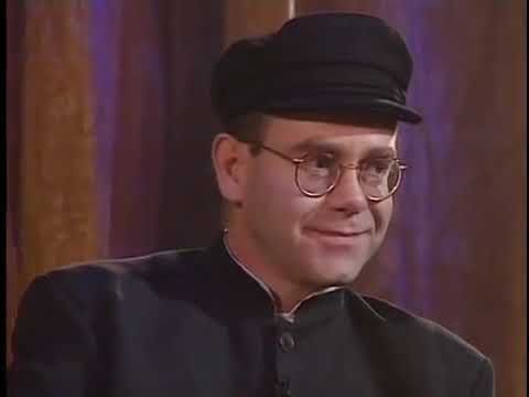 Detail Elton John Rowan Atkinson Nomer 54