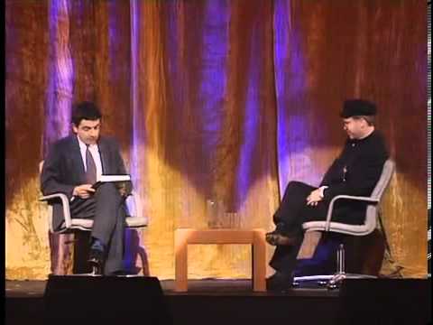 Detail Elton John Rowan Atkinson Nomer 9
