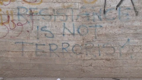 Detail From Graffiti To Terrorism Nomer 32