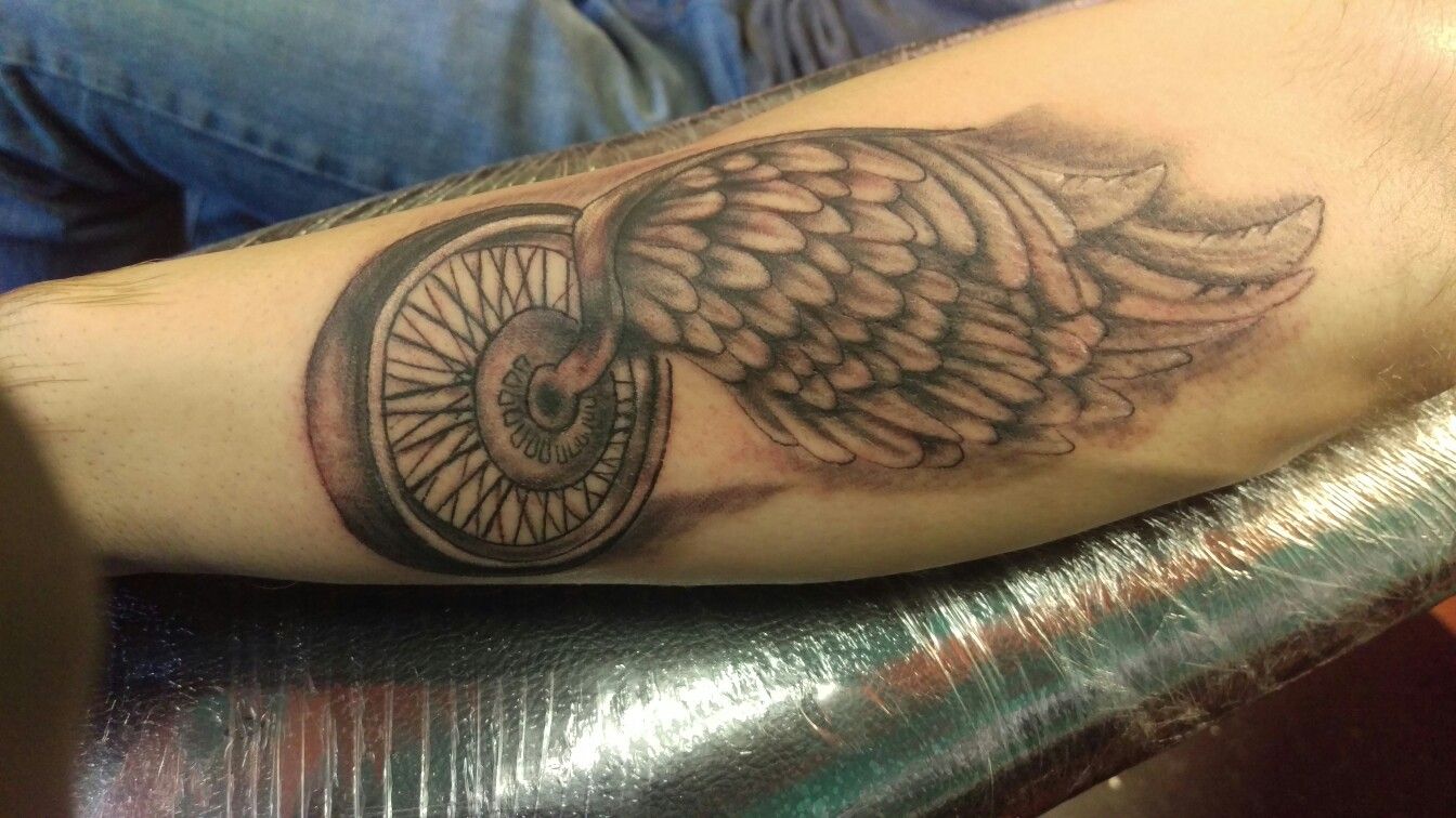 Detail Winged Motorcycle Wheel Tattoo Meaning Nomer 20