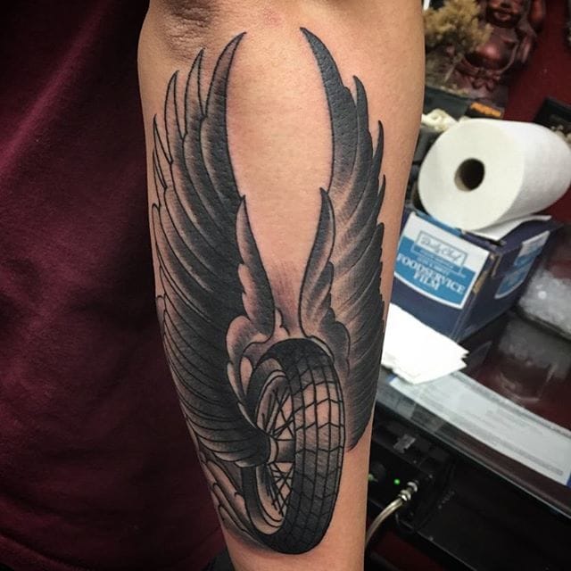 Detail Winged Motorcycle Wheel Tattoo Meaning Nomer 7