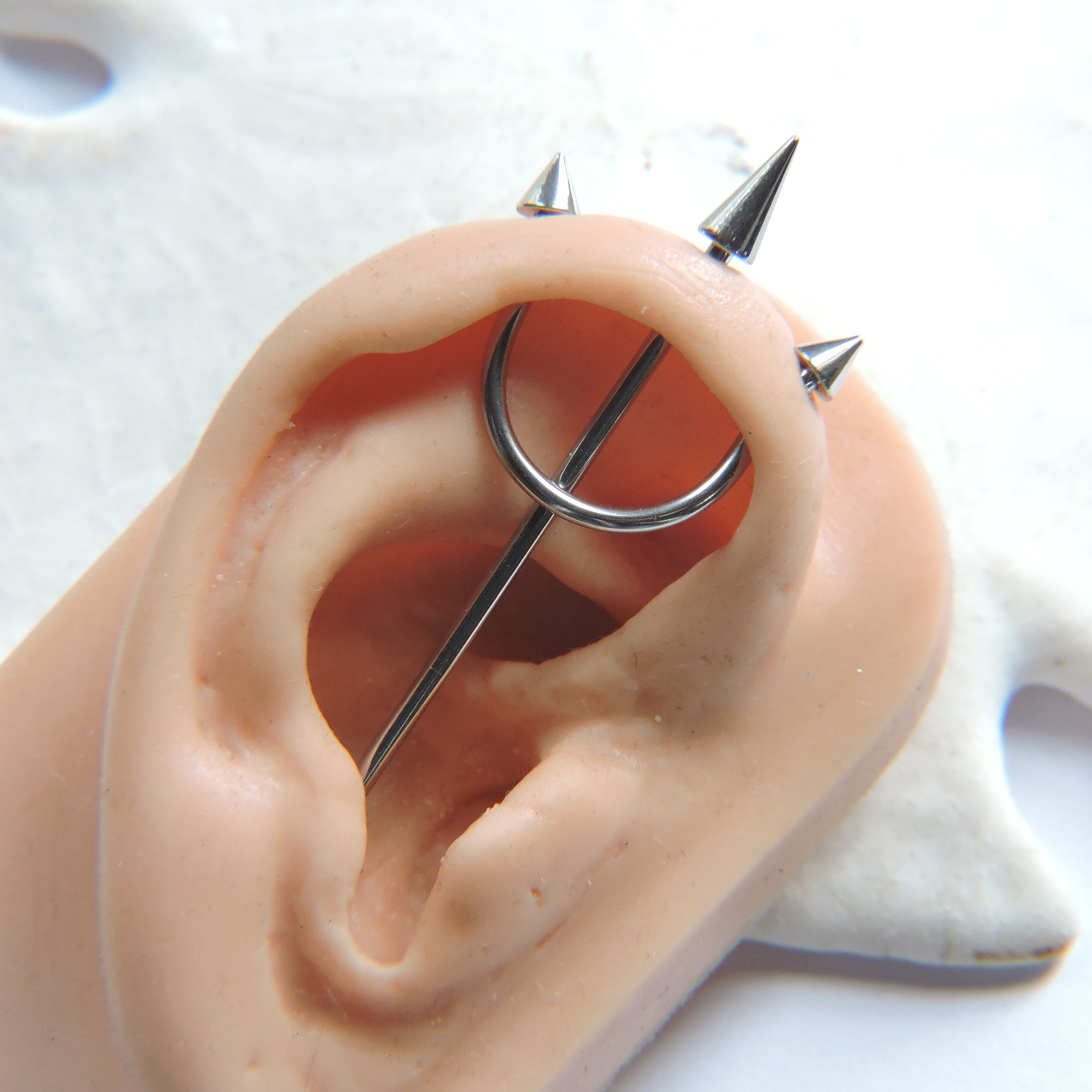 Detail Trident Ear Piercing Nomer 7